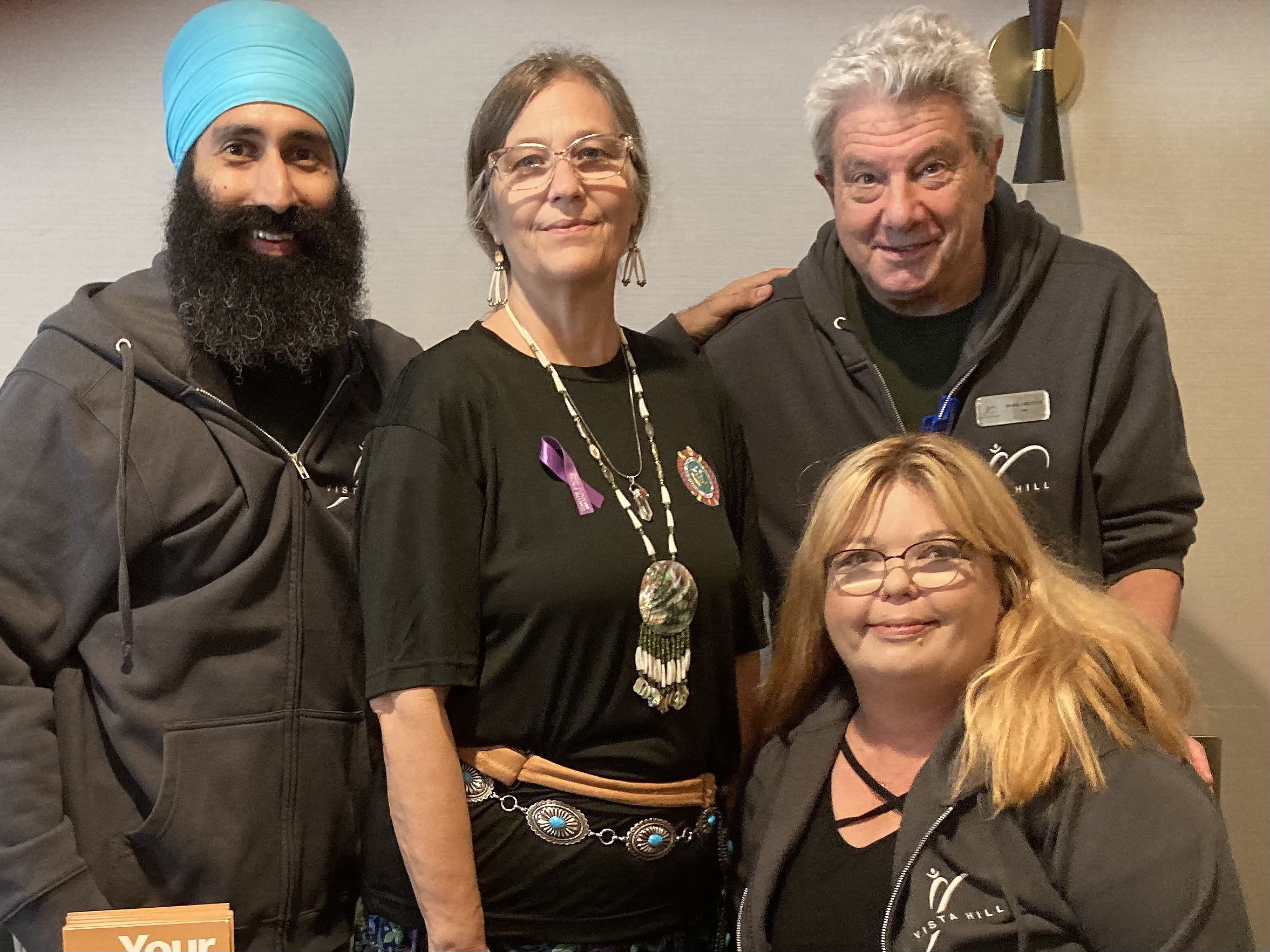 Left to right: Dr. Shawn Sidhu, Cari Gloria, Dr. Mark Chenven and seated Judy Whitcher at Southern Indian Health Council Conference, San Diego, 10/21/22.