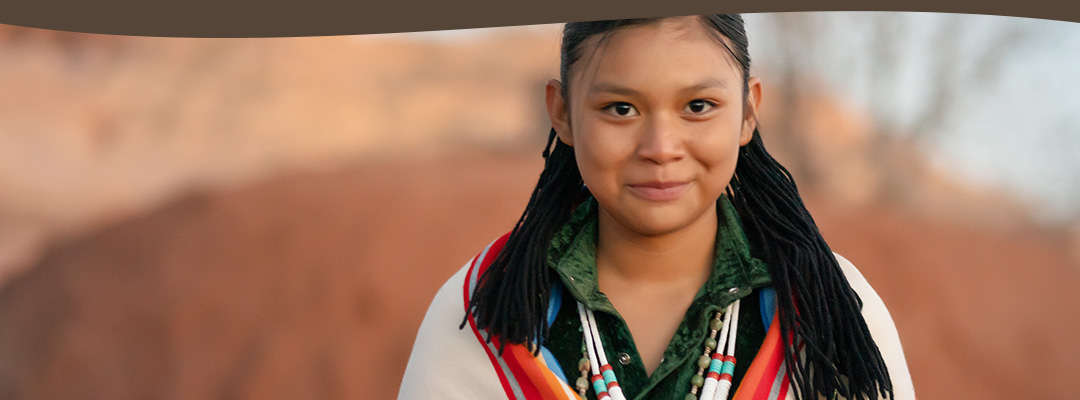 Native American child smiling.